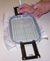 Marking the Sticky machine embroidery stabilizer.